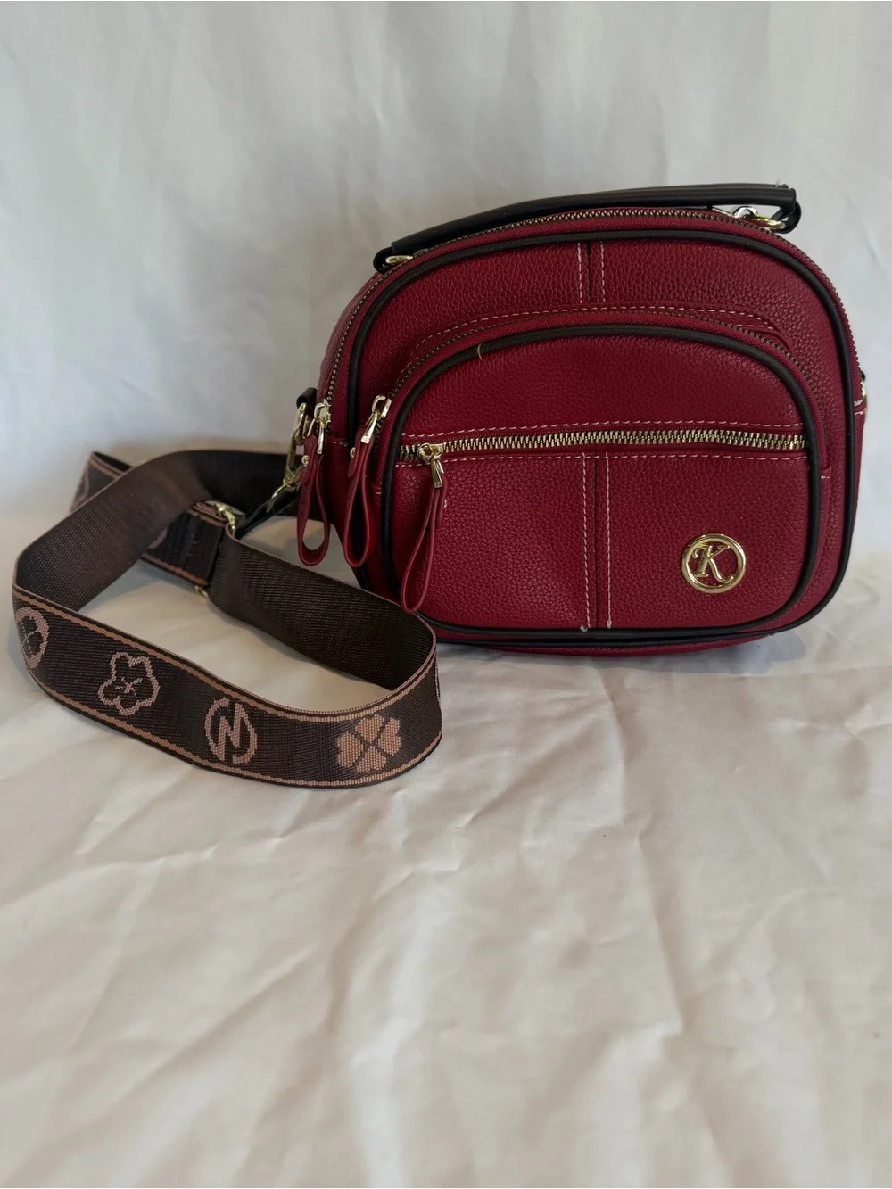 K-Emblem Tan Pebbled Leather Crossbody Bag with Patterned Strap